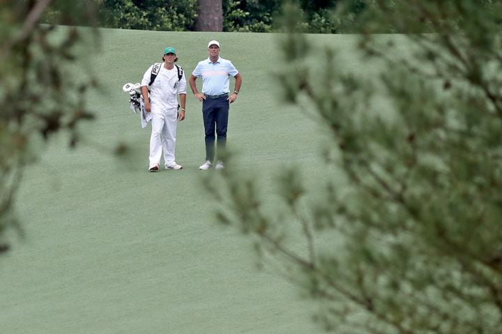 April 10, 2021, Augusta: Stewart Cink and caddie Reagan Cink prepare to hit on the second fairway during the third round of the Masters at Augusta National Golf Club on Saturday, April 10, 2021, in Augusta. Curtis Compton/ccompton@ajc.com
