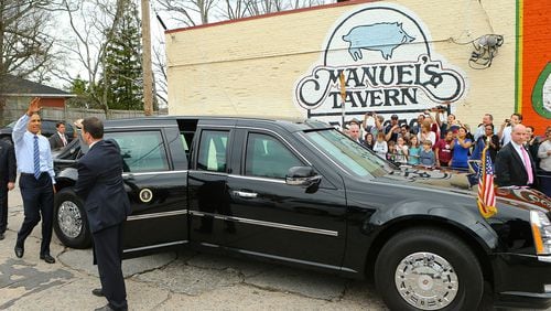 President Barack Obama waves to the crowd as he departs Manuel's Tavern, where he talked to college students and even played darts, in 2015. Customer service and great conversation have been hallmarks since the North Highland Avenue watering hole opened in 1956. Curtis Compton / ccompton@ajc.com