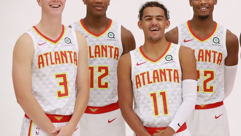 Hawks players (from left) Kevin Huerter, DeAndre Hunter, Trae Young and Cam Reddish.