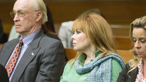 03/10/2018 -- Atlanta, GA - William "Billy" E. Corey, owner of U.S. Enterprises, left, and Dani Jo Carter, center, sit in the audience. End-of-day arguments in the Tex McIver murder trial focused on charges McIver attempted to influence witnesses, including Carter. ALYSSA POINTER/ALYSSA.POINTER@AJC.COM