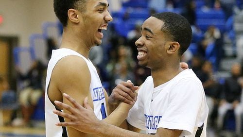 021716 ATLANTA: Westlake Lions James Lewis (left) and Joe Markham celebrate a 85-60 victory over Lovejoy in a first round playoff basketball game on Wednesday, Feb 17, 2016, in Atlanta.  Curtis Compton / ccompton@ajc.com