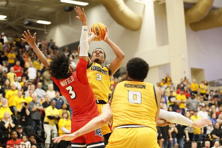 Kennesaw State guard Chris Youngblood (3) goes up for a basket against Liberty Flames guard Isiah Warfield (3) during the second half at the Kennesaw State Convention Center on Thursday, Feb 16, 2023.
 Miguel Martinez / miguel.martinezjimenez@ajc.com
