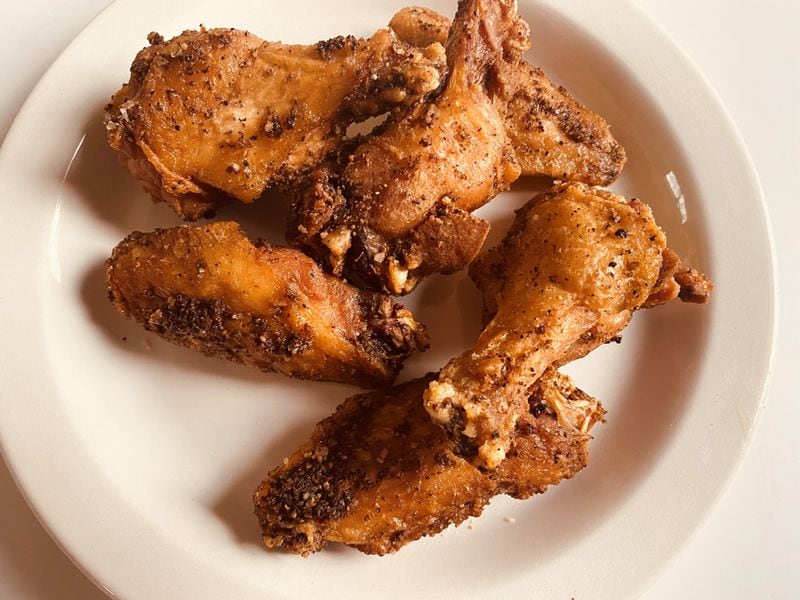 Chicken Out's crispy chicken wings are brined, smoked and then fried to order, with a choice of rub or sauce. Bob Townsend for The Atlanta Journal-Constitution 
