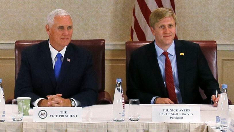 In this Aug. 1, 2017 file photo, Vice President Mike Pence, left, attends a meeting with Georgia opposition leaders in Tbilisi, Georgia. Chief of Staff to the Vice President, Nick Ayers, is right. Zurab Kurtsikidze/Pool Photo via AP