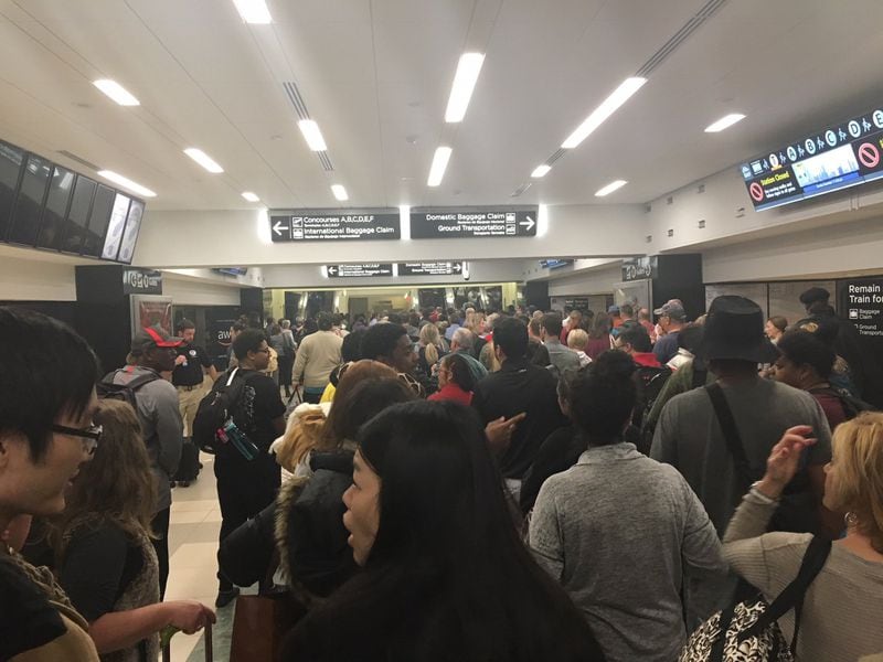 A mass exodus was evident from the concourses at Hartsfield-Jackson International Airport as a power outage dragged on for hours and into the evening. (Photo by Rick Crotts / AJC)