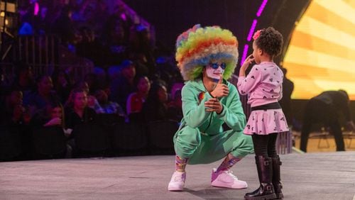 A UniverSoul Circus clown gives a young audience member a thumbs up during an early show for its 30th anniversary year.