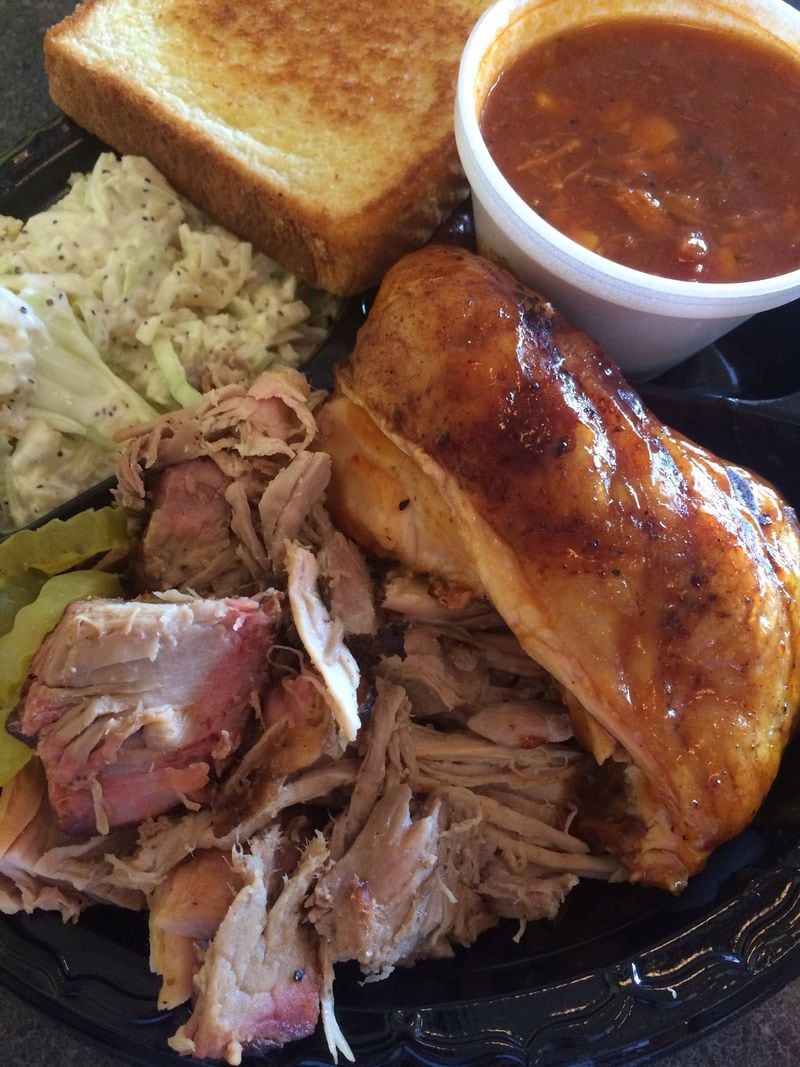 At Sam’s BBQ-1 in east Cobb, you can get a classic plate of Southern ‘cue. Here it’s pulled pork and smoked chicken with sides of slaw and Brunswick stew and a plank of Texas toast. CONTRIBUTED BY WENDELL BROCK