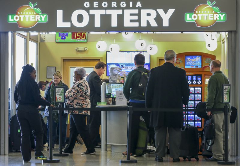 SECONDARY PHOTO - January 12, 2016 Hartsfield-Jackson International Airport : Lines formed outside at the Georgia Lottery Airport South Kiosk at Hartsfield-Jackson International Airport on Tuesday,  Jan. 12, 2016 as the record-breaking Powerball jackpot continued to climb, hitting $1.5 billion ahead of Wednesdays' drawing, according to the Georgia Lottery. Players who would take the cash option would win $930 million, before taxes. Winning isn't everything, though, and players should expect a barrage of con artists, lawsuit filers and taxes when they win. Remember, though, even if Wednesday's drawing fails to declare a winner, the children are the real winners. Since Powerball began rolling over on Nov. 7, the jackpot has generated an estimated $26.9 million for Georgia Lottery-funded Pre-K and HOPE Scholarships. Players have had until 10 p.m. Wednesday to buy $2 tickets, according to lottery officials. The drawing was held at 11 p.m. EST. and the result not available at the time of this report. JOHN SPINK /JSPINK@AJC.COM