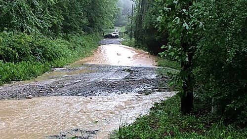A woman had to be rescued Thursday afternoon after flood waters swept her SUV into Duke's Creek, located in northern White County. She was not seriously injured.