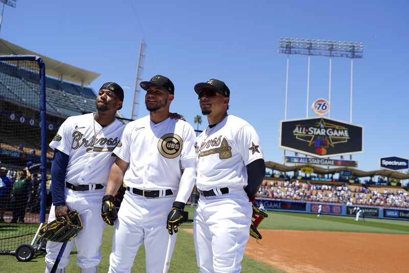 From left Ronald Acuña Jr., of the Atlanta Braves, catcher Wilson Contreras, of the Chicago Cubs, and his brother William Contreras, of the Atlanta Braves, stand together during batting practice before the MLB All-Star baseball game, Tuesday, July 19, 2022, in Los Angeles. (AP Photo/Jae C. Hong )