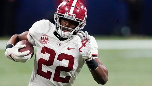 Alabama running back Najee Harris (22) runs against Florida during the second half of the Southeastern Conference championship game, Saturday, Dec. 19, 2020, at Mercedes-Benz Stadium in Atlanta. (John Bazemore/AP)
