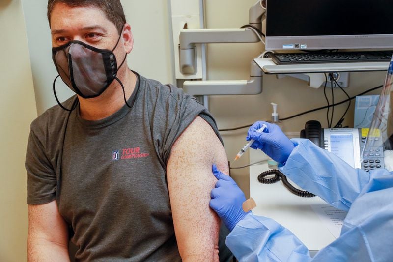 Robert Gilleo receives his monkeypox vaccination from Yolanda Johnson, BSN RN, at the North Dekalb Health Center in Chamblee on August 5, 2022. Steve Schaefer / steve.schaefer@ajc.com)
