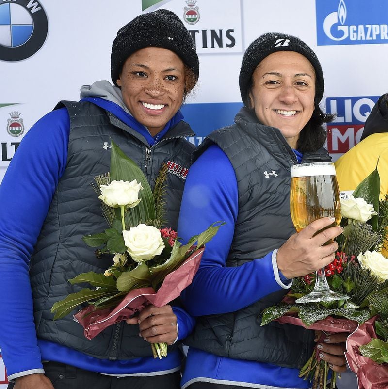 Elana Meyers Taylor (right) and teammate Lauren Gibbs celebrate their second-place win in Winterberg, Germany’s women’s bobsled World Cup on Dec. 9, 2017. CONTRIBUTED BY DIETMAR REKER