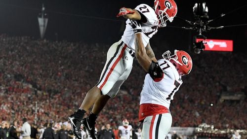 PASADENA, CA - JANUARY 01: Nick Chubb #27 of the Georgia Bulldogs and  Isaiah Wynn #77 celebrate  after Chubb scores a touchdown in the 2018 College Football Playoff Semifinal Game against the Oklahoma Sooners at the Rose Bowl Game presented by Northwestern Mutual at the Rose Bowl on January 1, 2018 in Pasadena, California.  (Photo by Matthew Stockman/Getty Images)