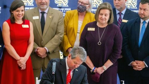 Gov. Brian Kemp signs a half dozen education bills surrounded by government officials and advocates at Kennesaw State University Tuesday, May 4, 2021. STEVE SCHAEFER FOR THE ATLANTA JOURNAL-CONSTITUTION