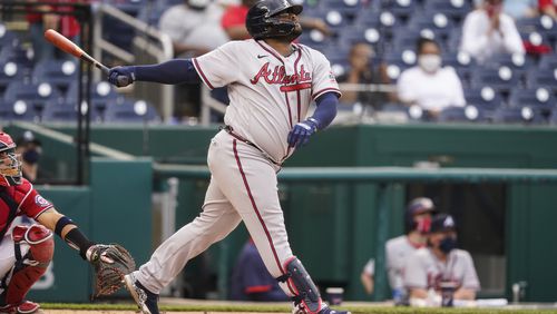 Atlanta Braves' Pablo Sandoval watches his two-run homer during the seventh inning of the second baseball game of a doubleheader against the Washington Nationals, at Nationals Park, Wednesday, April 7, 2021, in Washington.The Braves won the second game 2-0. (AP Photo/Alex Brandon)