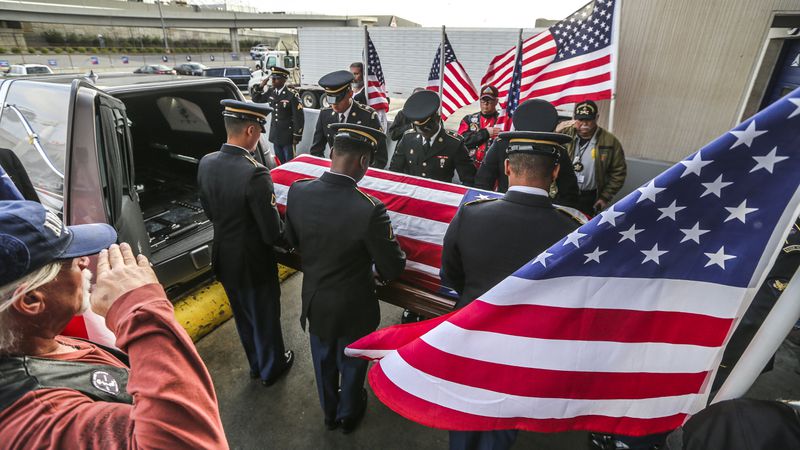 The Georgia National Guard Honor Guard place the body of United States Army Pfc. Lamar Eugene Newman who served during the Korean War and went MIA and declared deceased in November of 1950 in the hearse after returning home after 67-years.