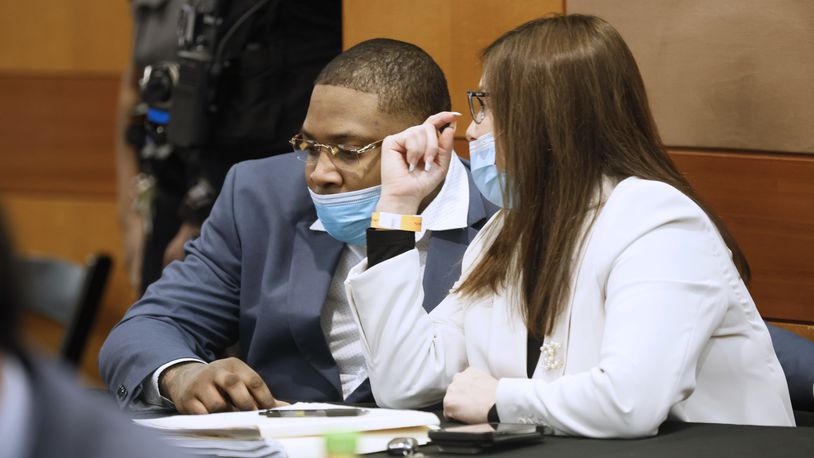 Nicole Fegan talks with her client, Tenquarius Mender, during the Young Slime Life gang trial. On Feb. 14, prosecutors filed a motion to sever the trial of Mender from that of the other YSL co-defendants after Fegan made the court aware of her imminent personal leave of absence due to pregnancy. (Miguel Martinez / miguel.martinezjimenez@ajc.com)