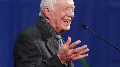 Jimmy Carter shares a laugh as he conducts his annual Town Hall with Emory University freshmen  in 2016 at the Woodruff P.E. Center. The former president was back at Emory on Wednesday night for his 36th annual town hall. File photo