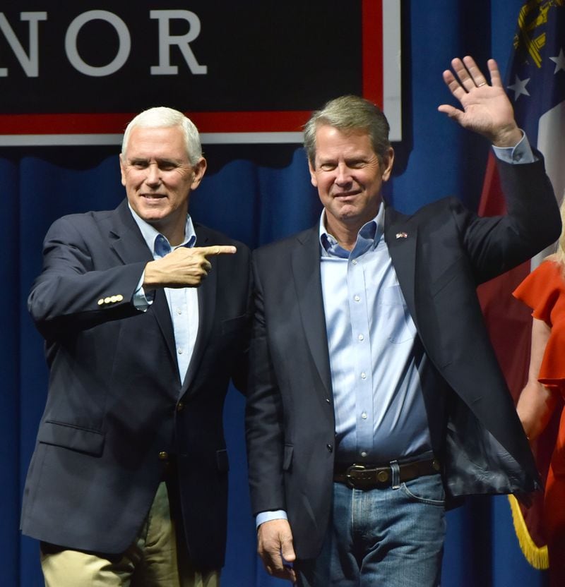 November 1, 2018 Dalton -  Vice President Mike Pence and GOP gubernatorial candidate Brian Kemp wave to supporters at Dalton Convention Center in Dalton on Thursday, November 1, 2018. The nationally-watched Georgia race for governor is about to get even more attention. Vice President Mike Pence is headed to Georgia on Thursday for a trio of events in conservative areas for Brian Kemp. Democrats are countering with a visit by Oprah Winfrey, who will appear with Stacey Abrams at a pair of town hall meetings. HYOSUB SHIN / HSHIN@AJC.COM