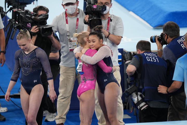 Sunisa Lee of the United State embraces Angelina Melnikova of the Russian Olympic Committee after Lee won the gold medal in the women's all-around gymnastics competition at the postponed 2020 Tokyo Olympics in Tokyo on Thursday, July 29, 2021. Melnikova finished with the bronze medal. (Doug Mills/The New York Times)