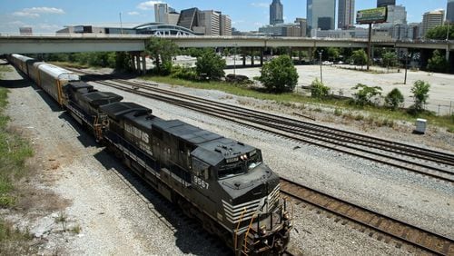 A Norfolk Southern train travels south close to the Mitchell Street bridge in the Gulch in Atlanta on May 28, 2013.