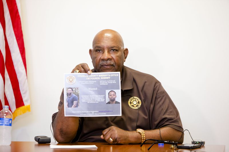 Douglas County Sheriff Tim Pounds holds a press conference about 34-year-old Harold Dakers, the suspect in a recent homicide who remains at large in the county. CHRISTINA MATACOTTA FOR THE ATLANTA JOURNAL-CONSTITUTION.