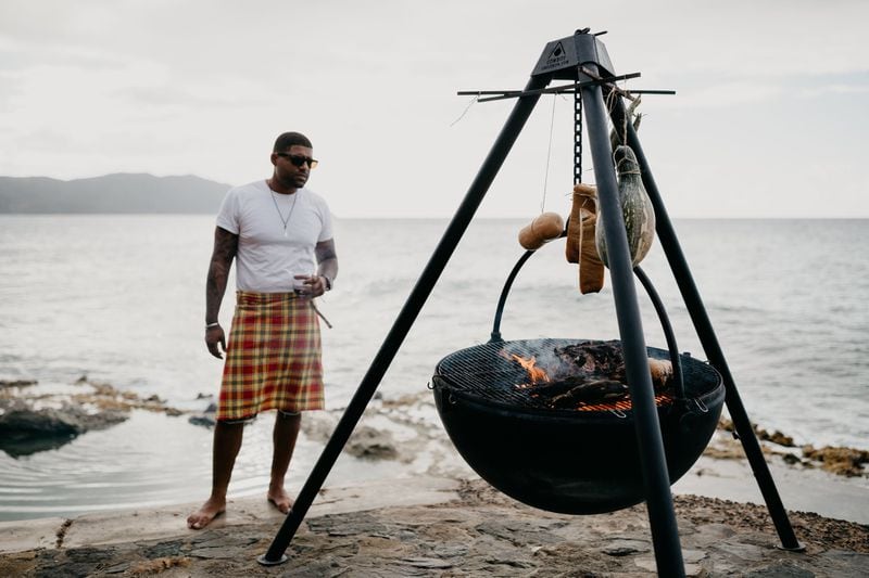 Chef Digby Stridiron grills on the beach adjacent to his restaurant Ama in St. Croix. CONTRIBUTED BY MEREDITH ZIMMERMAN
