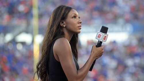 FILE - In this Aug. 24, 2019, file photo, ESPN's Maria Taylor works from the sideline during the first half of an NCAA college football game between Miami and Florida in Orlando, Fla. Taylor is leaving ESPN after the two sides were unable to reach an agreement on a contract extension. Taylor had been with ESPN since 2014 but her contract expired Tuesday, July 20, 2021. Her last assignment for the network was Tuesday night at the NBA Finals, where she was the pregame and postgame host for the network's “NBA Countdown” show.  (AP Photo/Phelan M. Ebenhack, File)