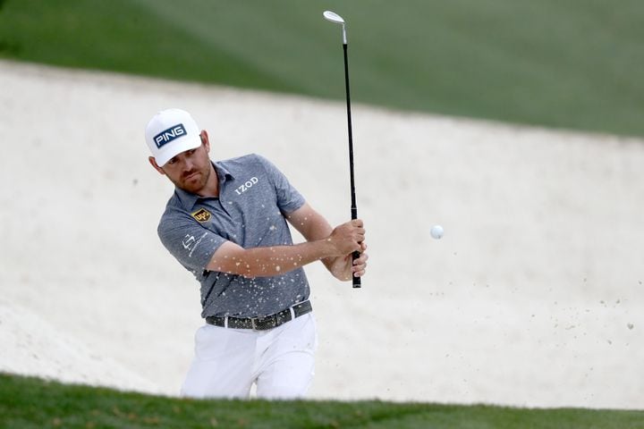 April 8, 2021, Augusta: Louis Oosthuizen hits out of the bunker on the tenth hole during the first round of the Masters at Augusta National Golf Club on Thursday, April 8, 2021, in Augusta. Curtis Compton/ccompton@ajc.com
