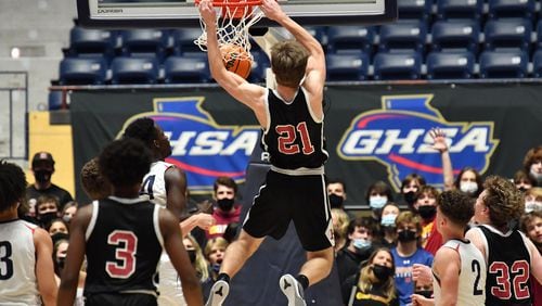 March 10, 2021 Macon - Holy Innocents' Landon Kardian (21) dunks the ball during the 2021 GHSA State Basketball Class A Private Championship game at the Macon Centreplex in Macon on Wednesday, March 10, 2021. Mt. Pisgah won 43-41 over Holy Innocents. (Hyosub Shin / Hyosub.Shin@ajc.com)