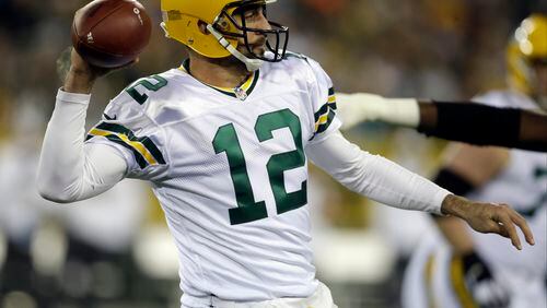 FILE - In this Oct. 20, 2016, file photo, Green Bay Packers quarterback Aaron Rodgers (12) throws during the first half of an NFL football game against the Chicago Bears, in Green Bay, Wis. The Packers know they’ve got their work cut out this week against the Atlanta Falcons. (AP Photo/Kiichiro Sato, File)