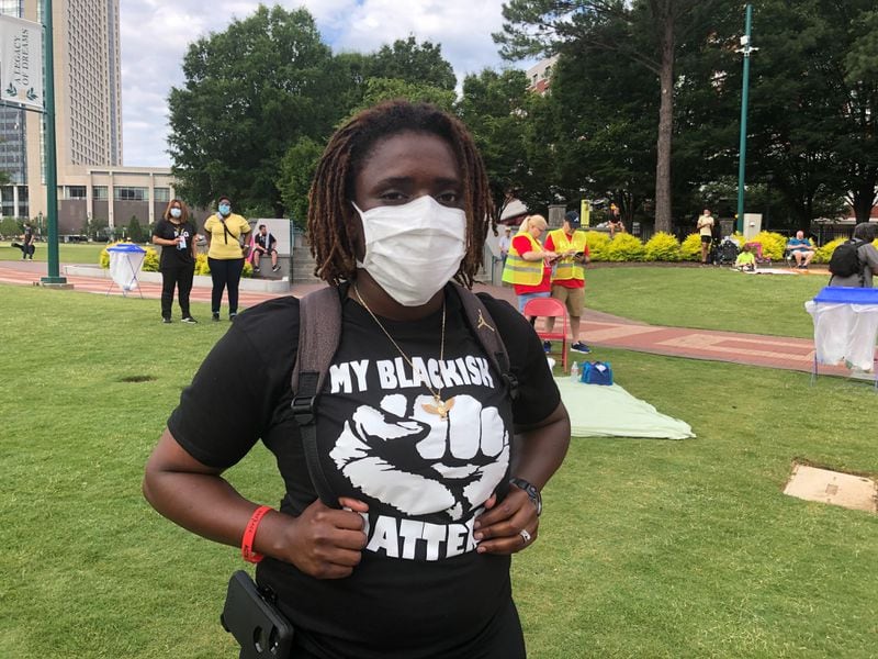 Former police officer, Erica Bolden, 30, participates in the "March on Atlanta" Juneteenth observance Friday, June 19, 2020. 