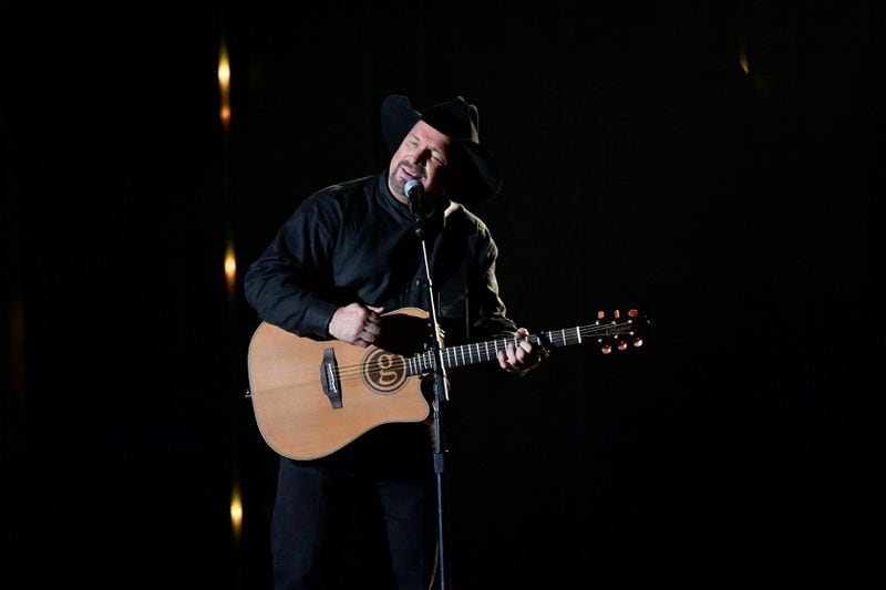 Garth Brooks performed at the CMA Awards, but also called for a moment of silence to honor the 12 victims of the California bar shooting. (Photo by Michael Loccisano/Getty Images)