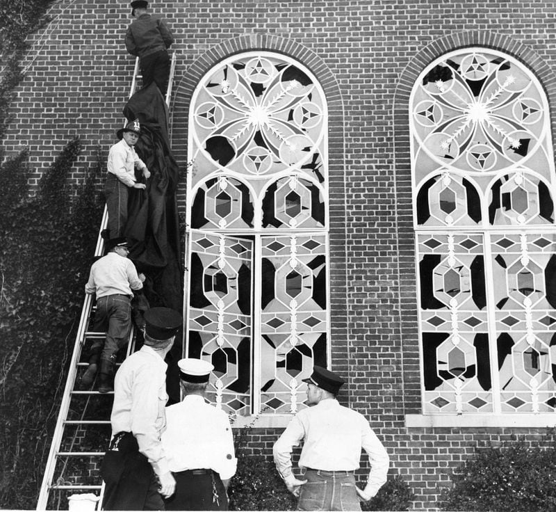 Twenty-six windows at The Temple were shattered by the bombing. AJC FILE