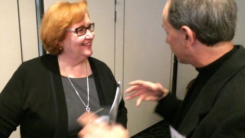 Virginia Hepner, president and CEO of the Woodruff Arts Center, talks with Mike Skrynecki, a member of the Business Connect club, during a breakfast meeting Friday.