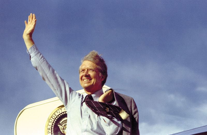 (file photo) Jimmy Carter waves from Air Force One, May 1977.  Courtesy Jimmy Carter Library. 