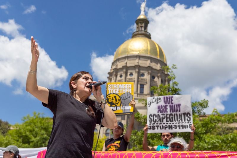 Adelina Nicholls, co-founder of the Georgia Latino Alliance for Human Rights (GLAHR), speaks during a protest against HB 1105, which would would mandate that local law enforcement work more closely with ICE, at Liberty Plaza in front of the Capitol in Atlanta on Wednesday, May 1, 2024. (Arvin Temkar / AJC)