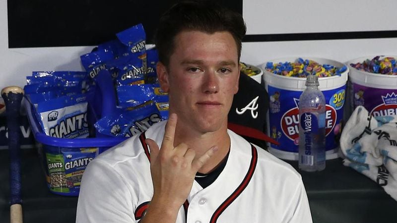 Pitcher Kolby Allard of the Braves gestures while sitting in the dugout before his MLB pitching debut during the game against the Miami Marlins at SunTrust Park on July 31, 2018. (Photo by Mike Zarrilli/Getty Images)
