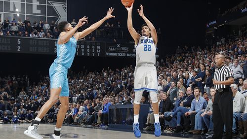 Kaiser Gates (22), shoots a three-pointer in a February 2018 game against Georgetown. A graduate of St. Francis High School in Alpharetta, he will leave Xavier a year early to pursue a career in the NBA.