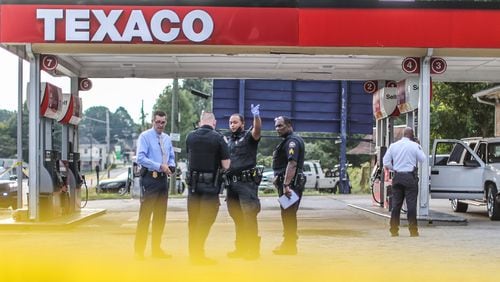 Atlanta police have blocked off the parking lot of a Texaco station on Martin Luther King Jr. Drive with crime scene tape after a fatal stabbing Monday morning. A related shooting was under investigation at an apartment complex less than a block away.