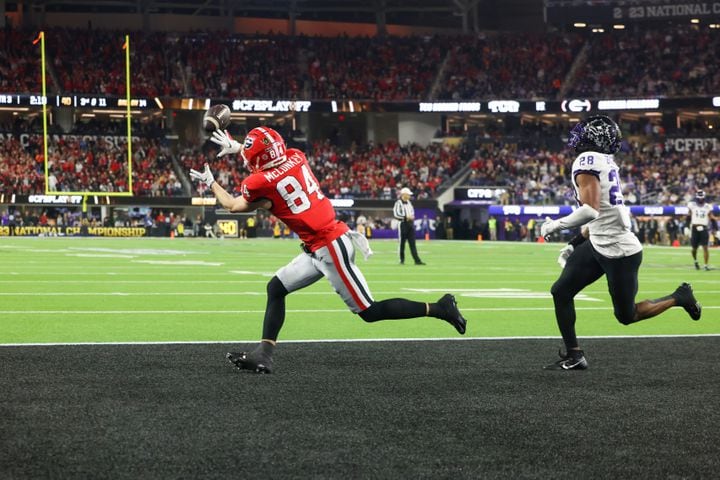Georgia Bulldogs wide receiver Ladd McConkey (84) catches a touchdown pass against TCU Horned Frogs safety Millard Bradford (28) during the second half of the College Football Playoff National Championship at SoFi Stadium in Los Angeles on Monday, January 9, 2023. Georgia won 65-7 and secured a back-to-back championship. (Jason Getz / Jason.Getz@ajc.com)