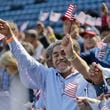 September 16, 2016 -  Atlanta -  Newly sworn in citizens cheer and wave flags after taking their oath of citizenship.   The "New Americans Project, "a voter registration effort organized by the League of Women Voters of Georgia,  over the past three years has managed to register more than 15,000 newly minted citizens. On Friday,  volunteers were staffing a table at Turner Field during a naturalization ceremony for 755 people -- with hopes that many of them stop by and sign up to become first-time voters in their adopted country.   BOB ANDRES  /BANDRES@AJC.COM