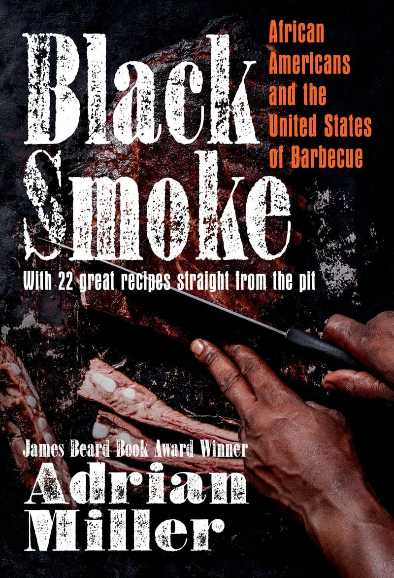 Bryan Furman's hands slicing ribs on the cover of "Black Smoke" by Adrian Miller.