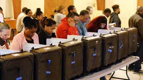 DeKalb County voters go to the polls on Election Day at the Crossroads Presbyterian Church in Stone Mountain on Tuesday morning. Kent D. Johnson, kdjohnson@ajc.com