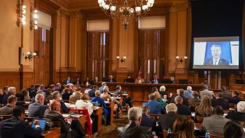Members of the legislature listen to Gov. Brian Kemp (on screen) at the start on budget hearings in Atlanta on Tuesday, January 17, 2023.   (Arvin Temkar/The Atlanta Journal-Constitution)