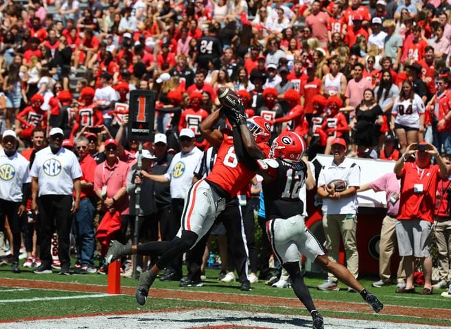 Georgia wide receiver Colbie Young catches a touchdown pass over defensive back Julian Humphrey for a 10-7 lead during the second quarter of the G-Day game on Saturday, April 13, 2024.  Curtis Compton for the Atlanta Journal Constitution