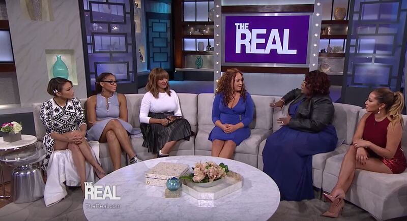 Rachel Dolezal, center, faces spirited questions on Monday's episode of "The Real."