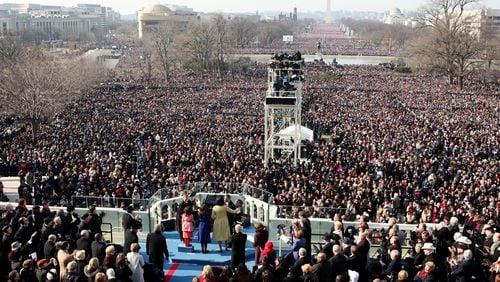 President-elect Donald Trump’s inaugural committee aims to raise as much as $75 million for a slate of events from Jan. 17 to Jan. 21, in part by leaning on giant corporations, including top Georgia firms such as Coca-Cola, Delta Air Lines, Southern Co. and UPS. Details won’t be made public until after the event, but that would set Trump on the path to exceed the record $53 million raised for President Barack Obama’s 2009 inauguration pictured above. Obama banned corporations and political action committees from donating to his inauguration in 2009, and he capped contributions from individuals at $50,000. But four years later, citing a tapped-out donor base, his inaugural committee lifted the cap for individuals and allowed companies to chip in. (Nancy Stone/Chicago Tribune/TNS)