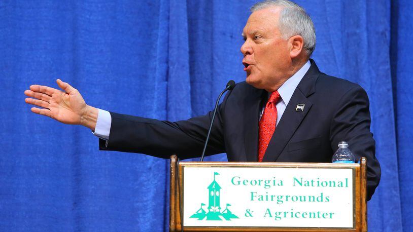100714 PERRY: Governor Nathan Deal makes a point while answering a question during the gubernatorial debate in Reaves Arena at the Georgia National Fair on Tuesday, Oct. 7, 2014, in Perry. CURTIS COMPTON / CCOMPTON@AJC.COM Nathan Deal, the Republican incumbent, makes a point while answering a question during the debate for governor in Reaves Arena at the Georgia National Fair on Tuesday in Perry. Curtis Compton, ccompton@ajc.com